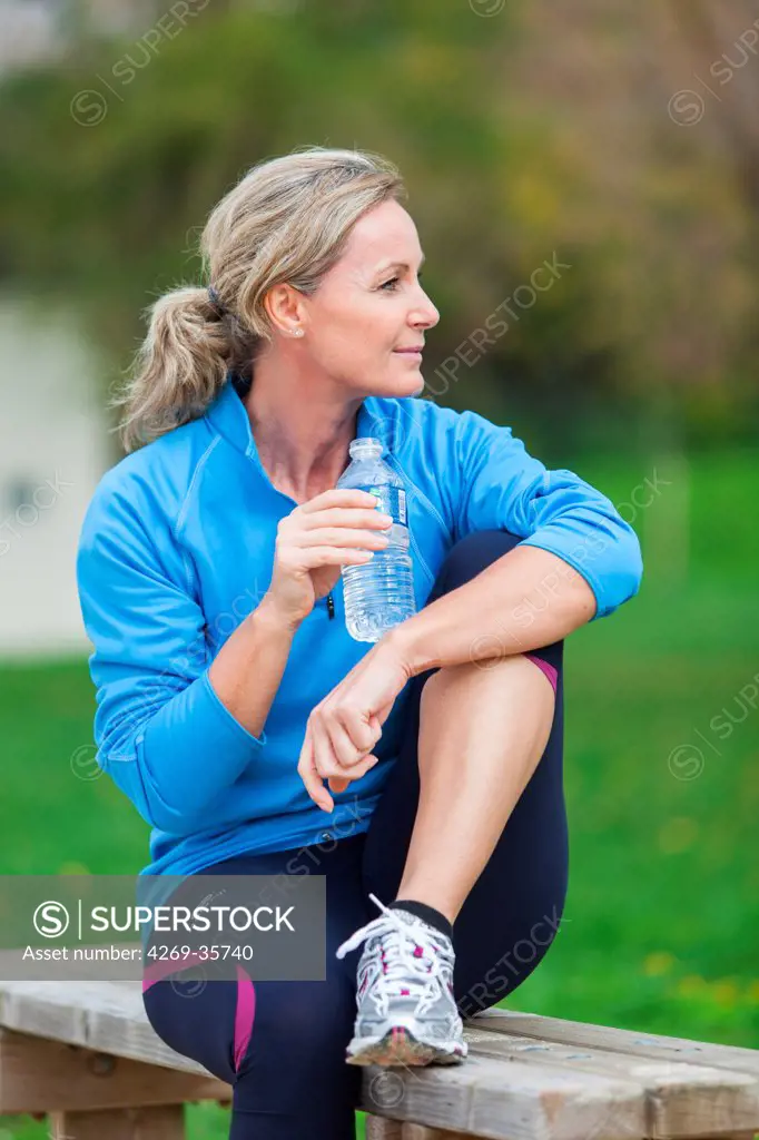Woman drinking water from a bottle