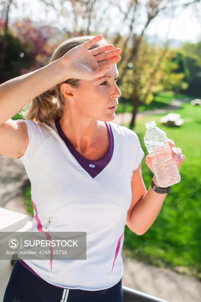 Woman drinking water from a bottle