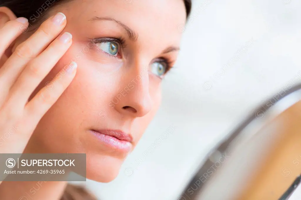 Woman checking for wrinkles