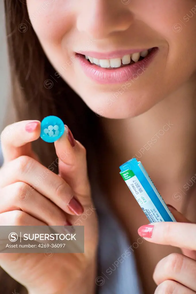 Woman taking homeopathic medicine
