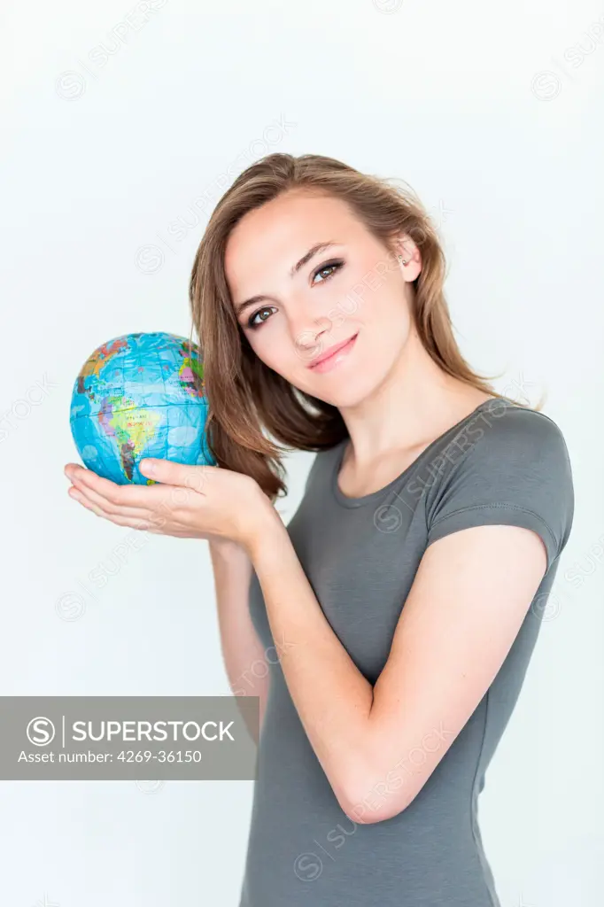 Woman holding a map of the world