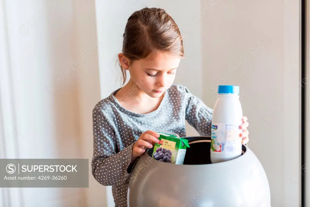Girl sorting recycled wastes