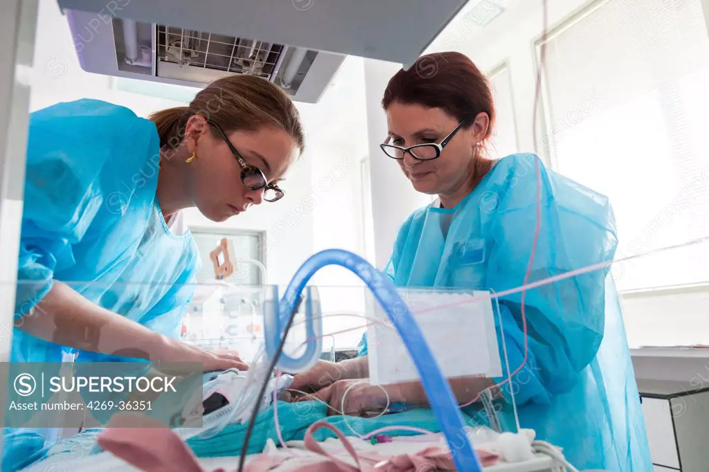 Physiotherapist and newborn baby placed under respiratory assistance Maternity department, Cochin hospital, Paris, France