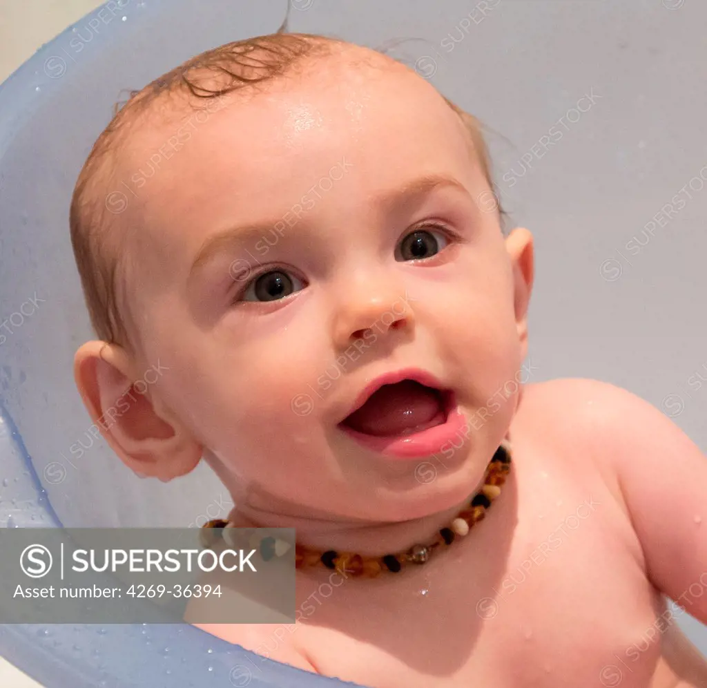 7 month old baby girl wearing a amber teething necklace