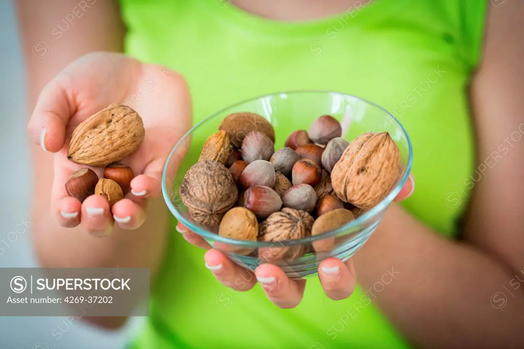 Food, Woman eating dry fruits.