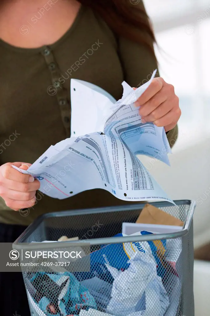 Woman, Woman throwing paper in the trash.