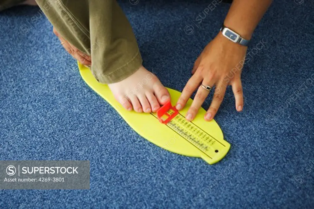 Prodys, a multidiciplinary consultation centre dedicated to dyslexia and Postural Deficiency Syndrome (PDS), Paris, France. Here, measurement of the size of the foot to make molded arch support insoles.