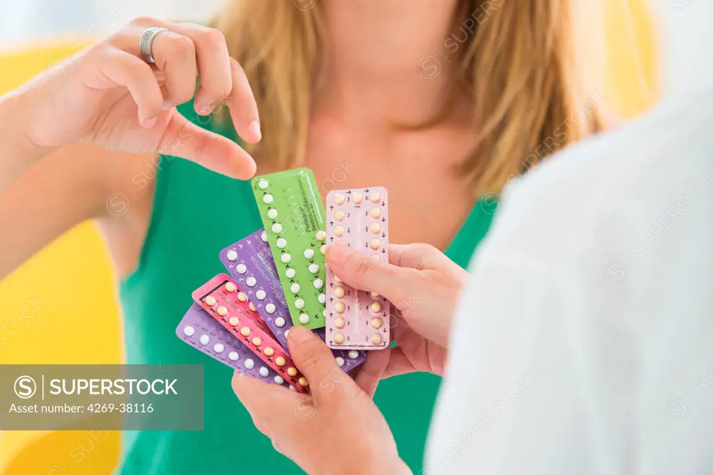Doctor discussing oral contraception with a young woman.