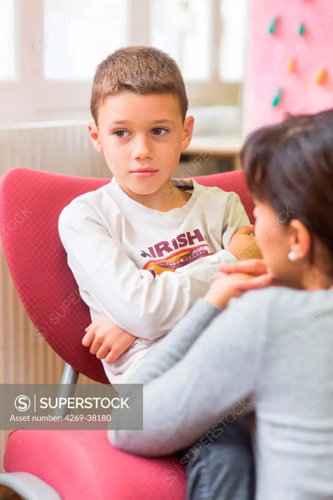 7 year old boy in psychotherapy session with a child psychiatrist.