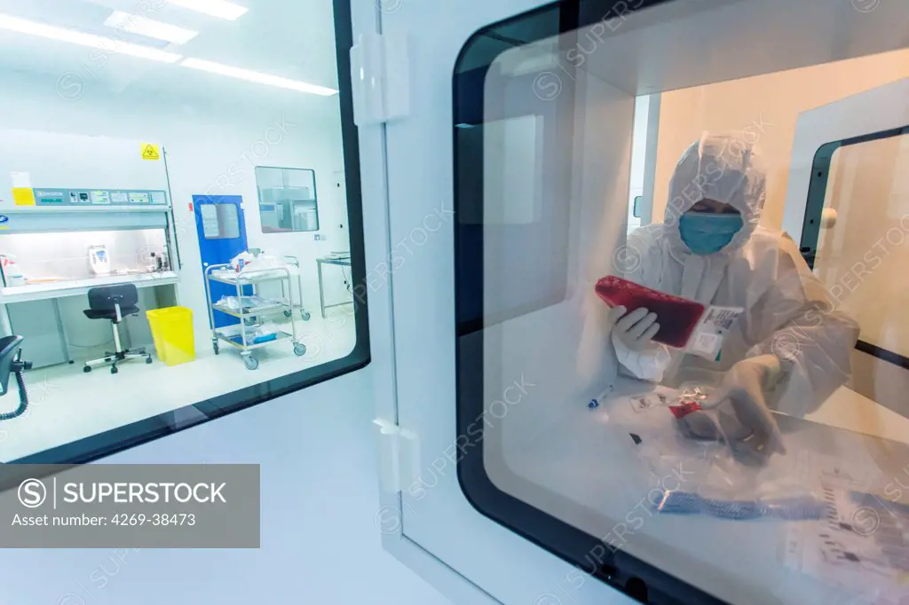 Technician preparing a hematopoietic stem cells bag , Cell Therapy Unit, CTSA in Clamart, France.