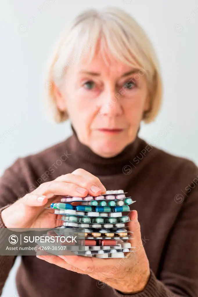 Woman holding medicine.