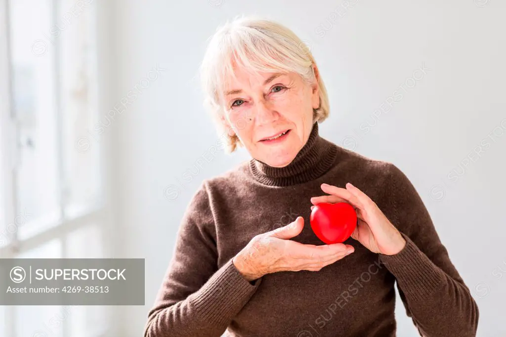 Woman holding heart.