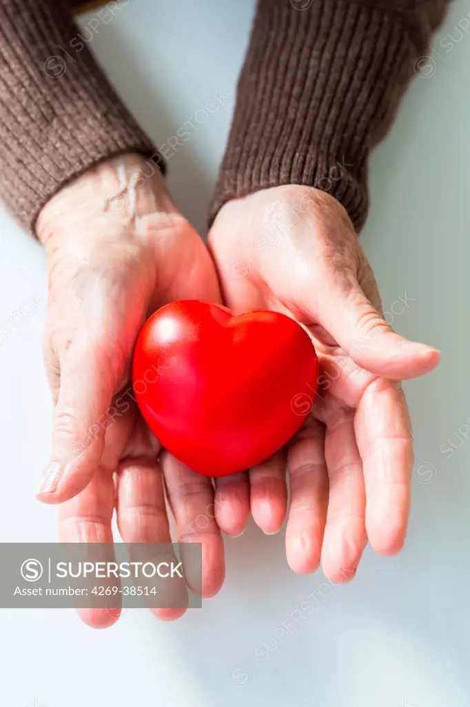 Woman holding heart.