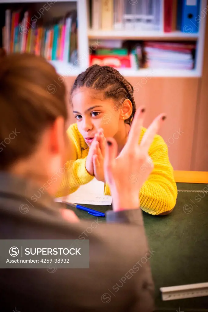 Child in a session with a speech therapist.