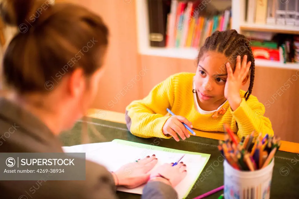 Child in a session with a speech therapist.
