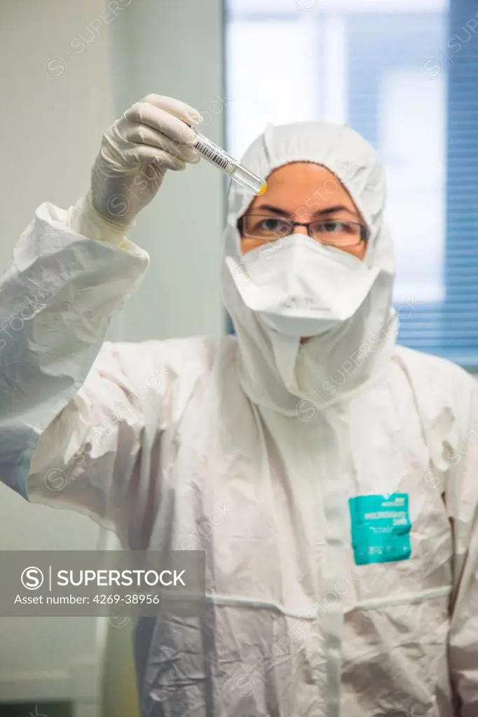 Researcher holding a test tube containing hepatitis virus in a high security laboratory of the Centre de Référence National des Hépatites virales, Henri Mondor Hospital, Creteil, France.