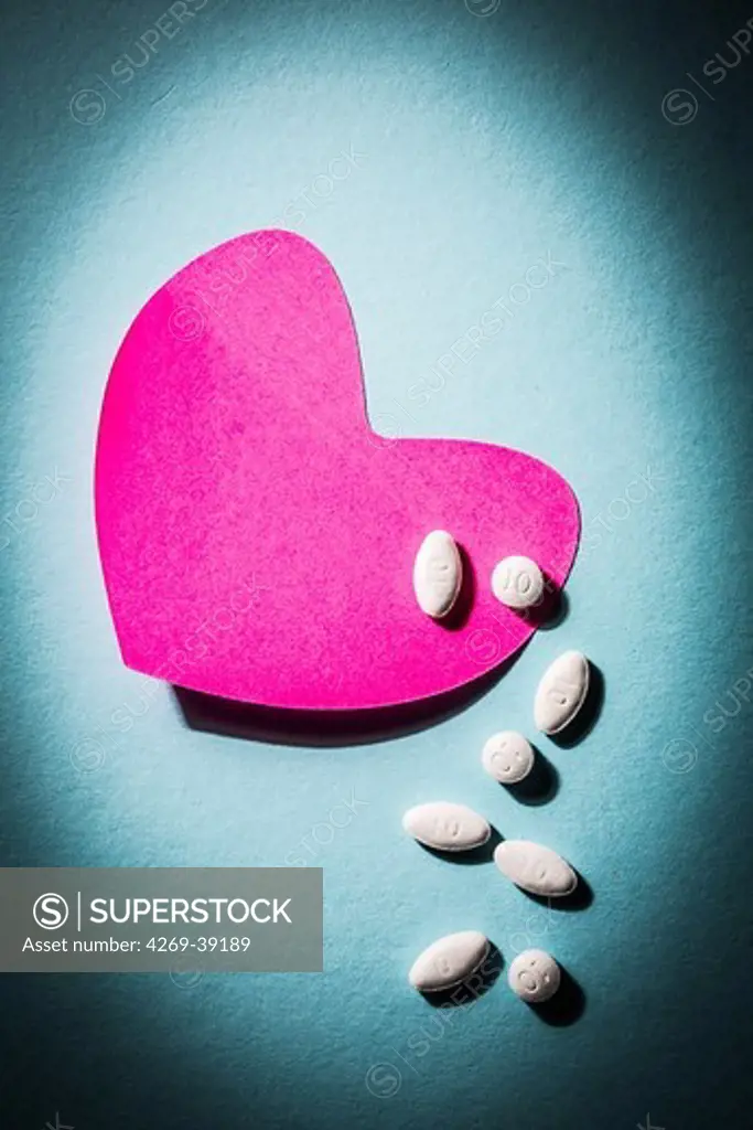 Heart drugs, conceptual image, tablets in heart-shaped post its.