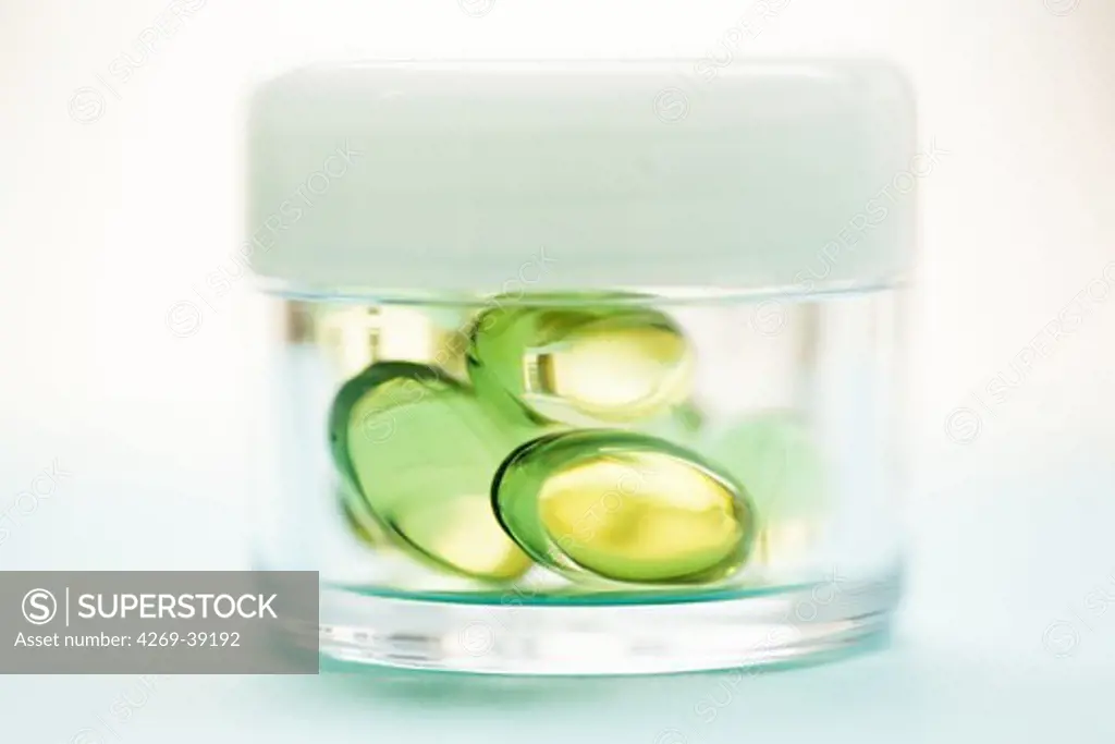 Nutritional supplements, liquid nutritional supplements in capsules on jar.