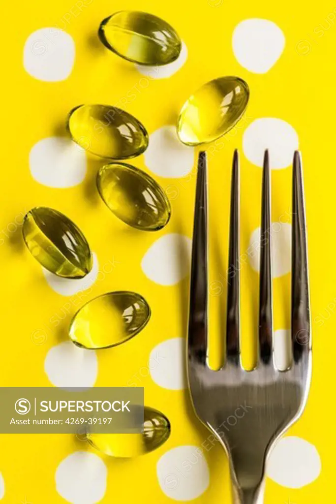 Nutritional supplements, liquid nutritional supplements in capsules with fork.
