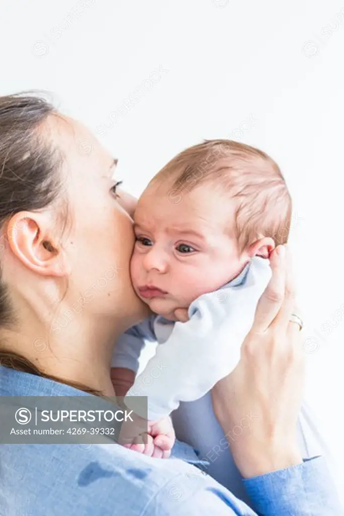 Mother holding her 2 month old baby boy.
