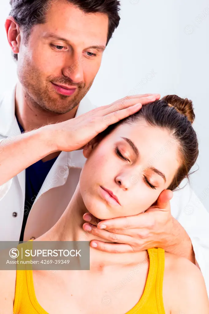 Structural osteopathy session in a woman suffering from neck pain.