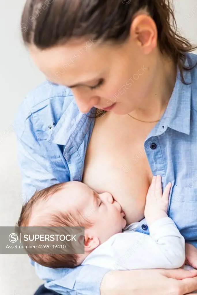 Mother breastfeeding her 2 month old son.