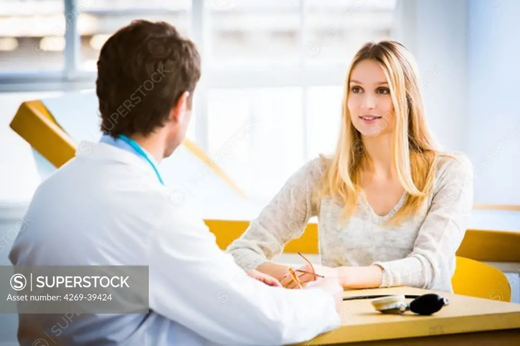 Doctor talking with a female patient.