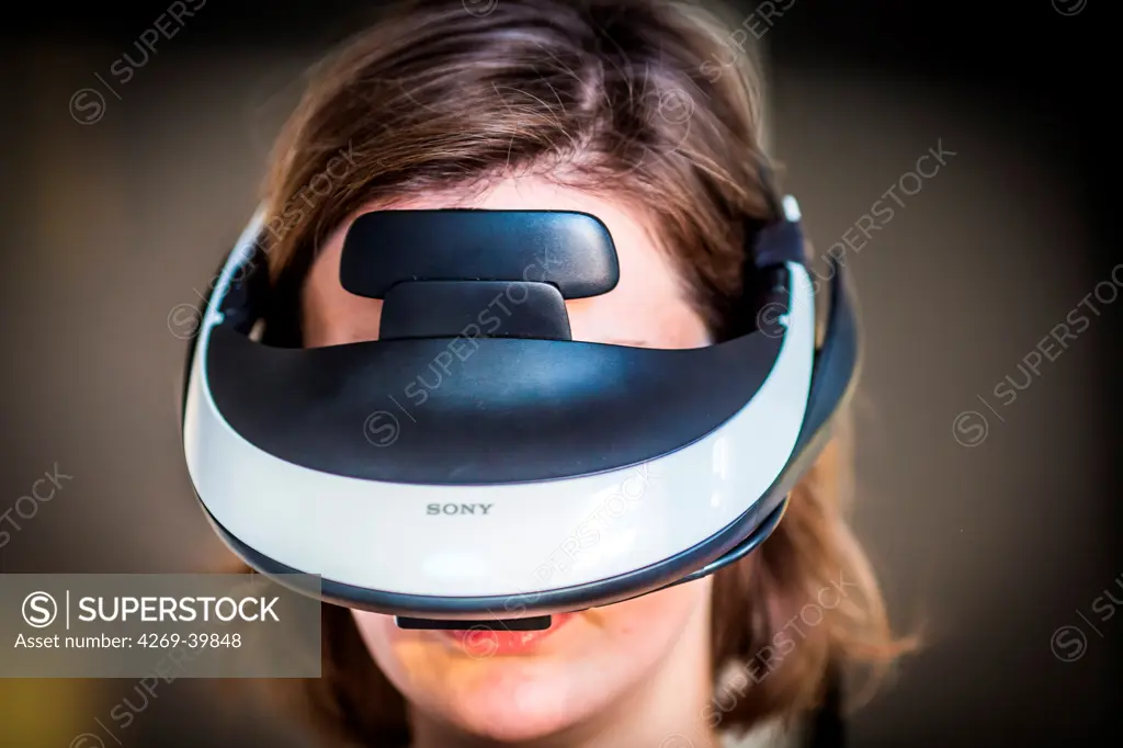 Woman wearing a helmet during a session of virtual reality therapy to treat phobia.