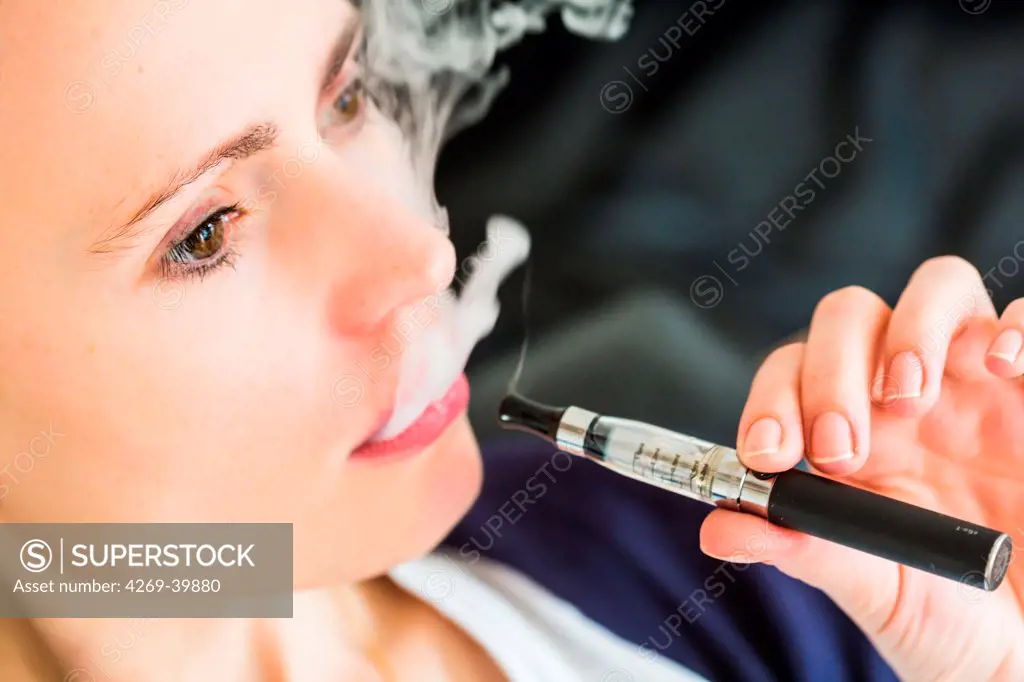 Woman smoking electronic cigarette.