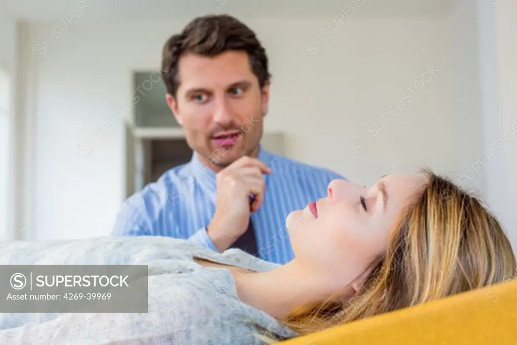 Woman undergoing hypnosis session with a sophrologist.