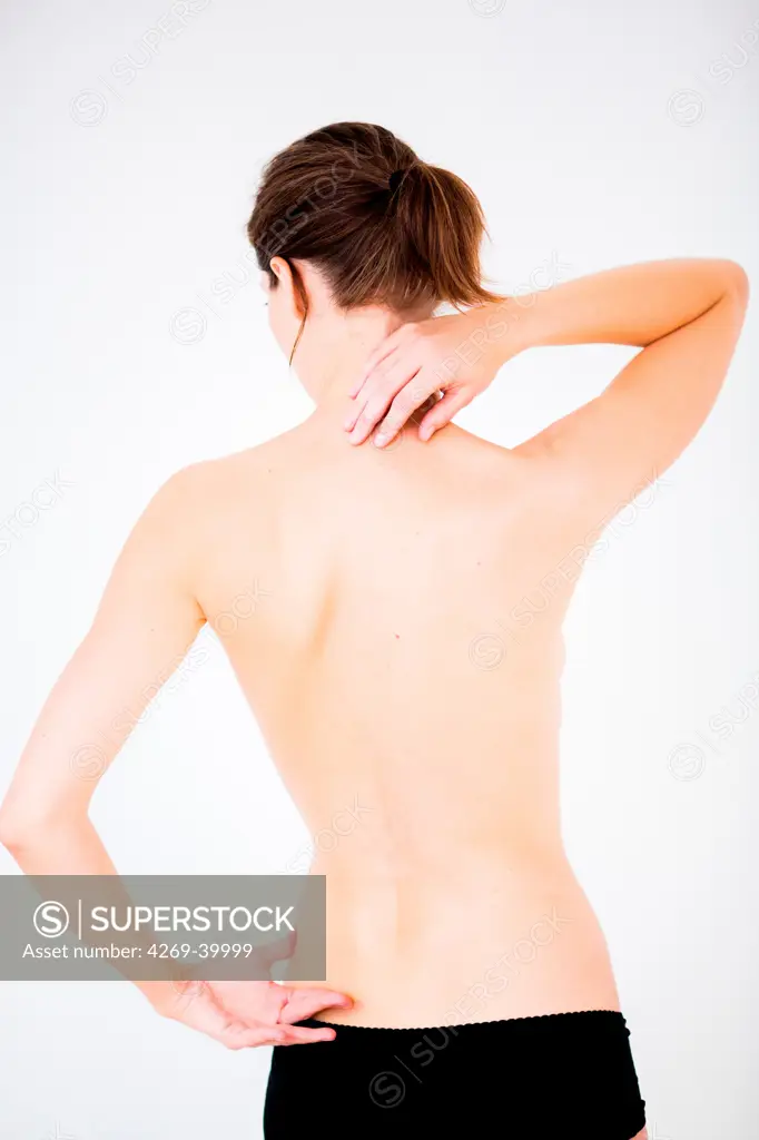 Woman suffering from neck and lumbar pain.