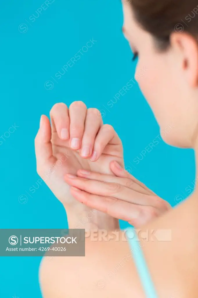 Woman watching her nails.