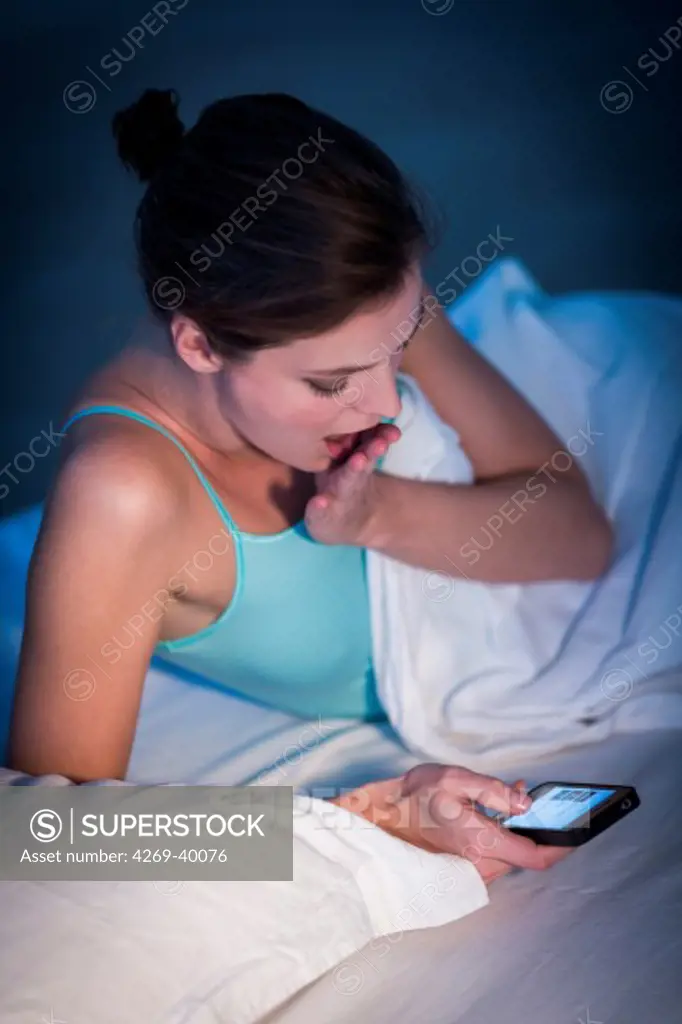 Woman touching the screen of an iphone®.
