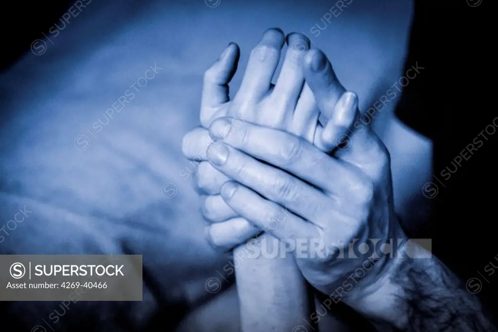 Woman receiving a hand massage.