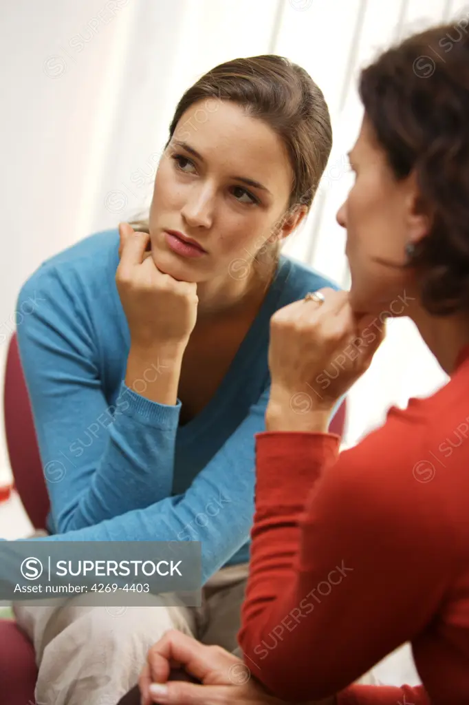 Two women talking.