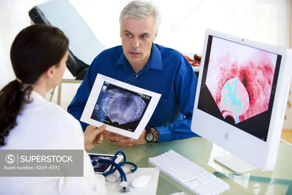 Doctor discussing prostate ultrasound scan with a patient.