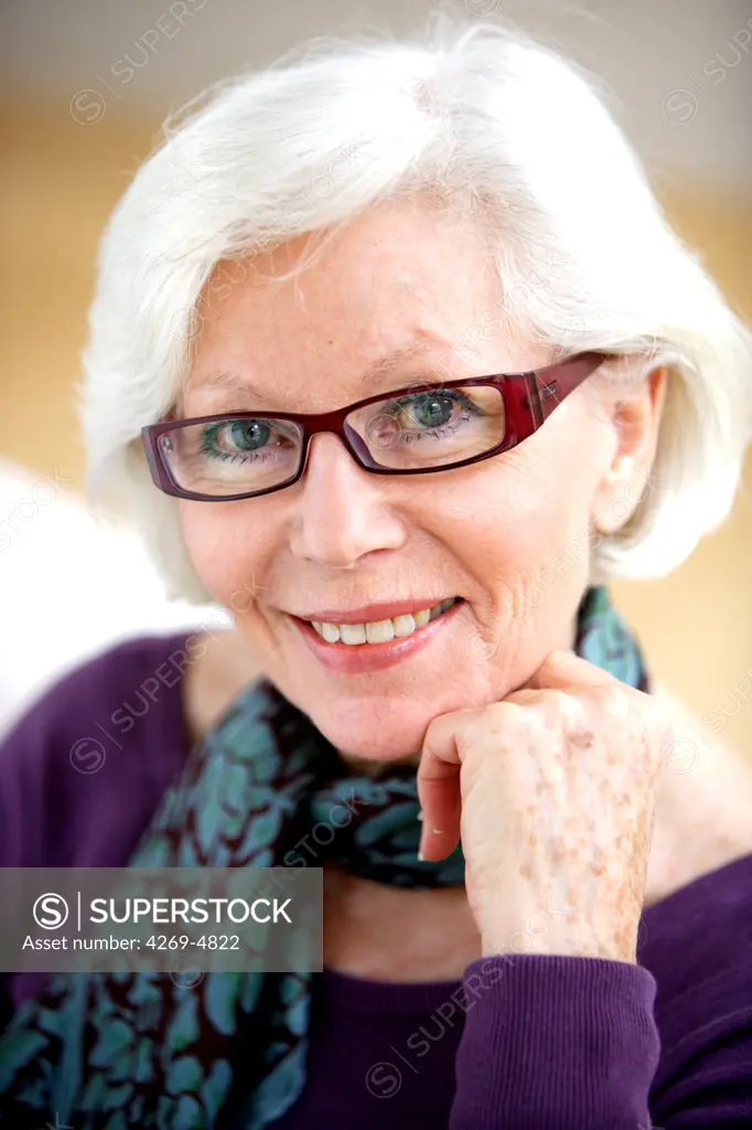 Portrait of elderly woman with glasses.