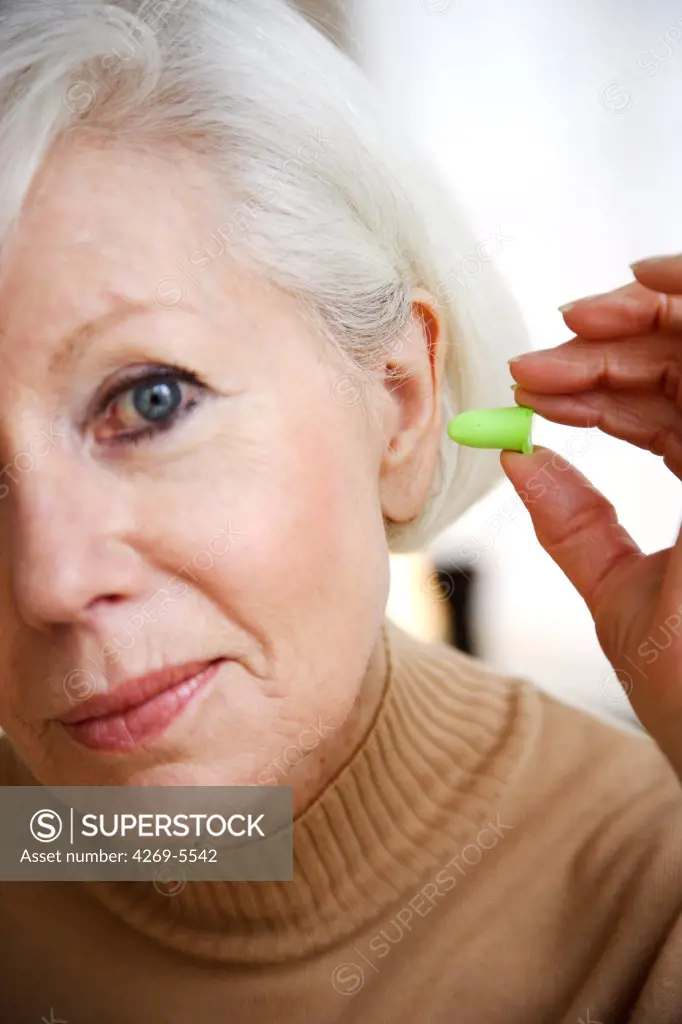Woman with ear plugs.