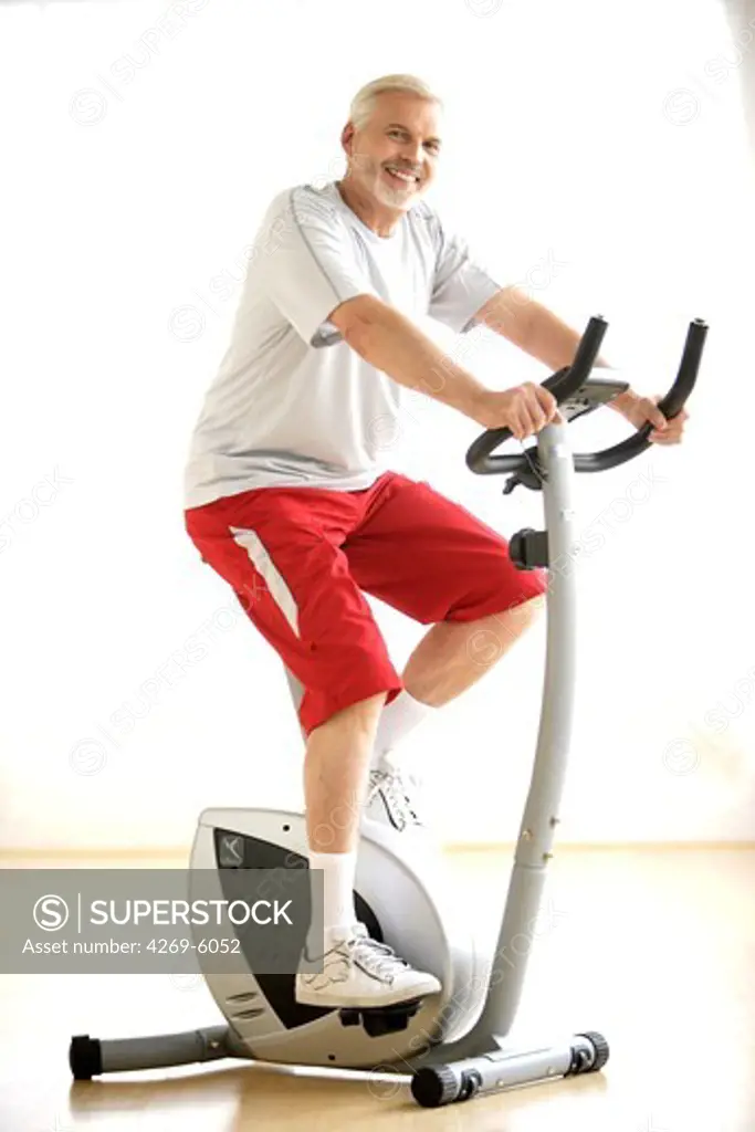 Man practising exercize bike.