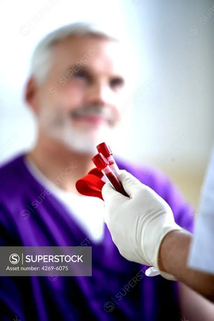 60 years old man having blood sample.