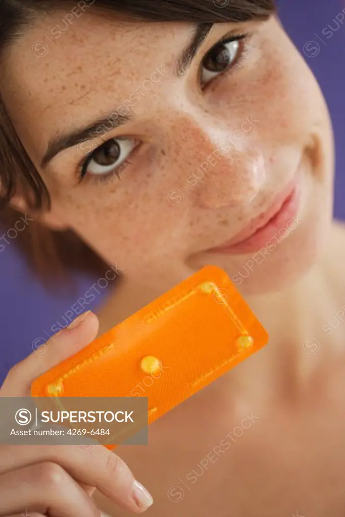 Woman holding the Norlevo morning-after pill (emergency contraceptive pill).