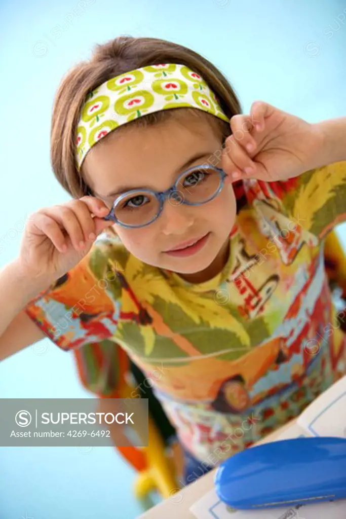 6 years old girl with prescription glasses.