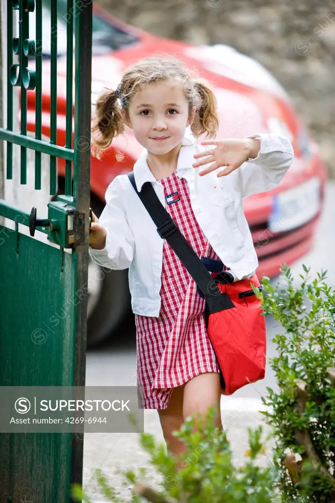 5 years old girl on the way to school.