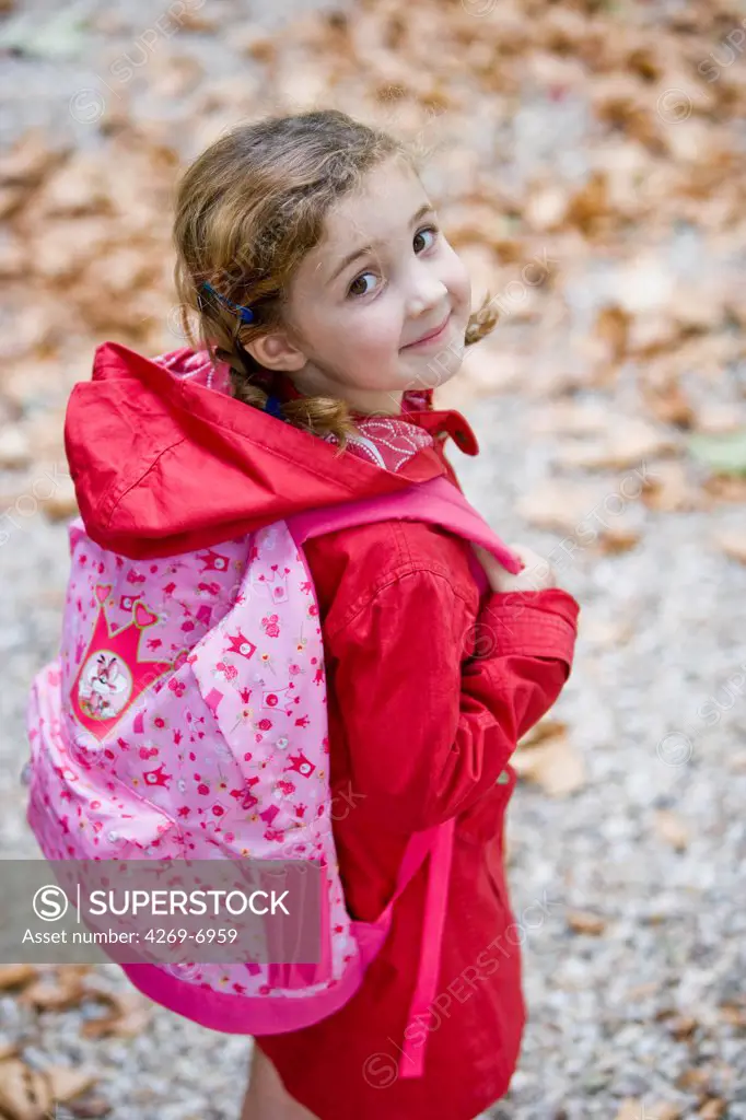 5 years old girl on the way to school.