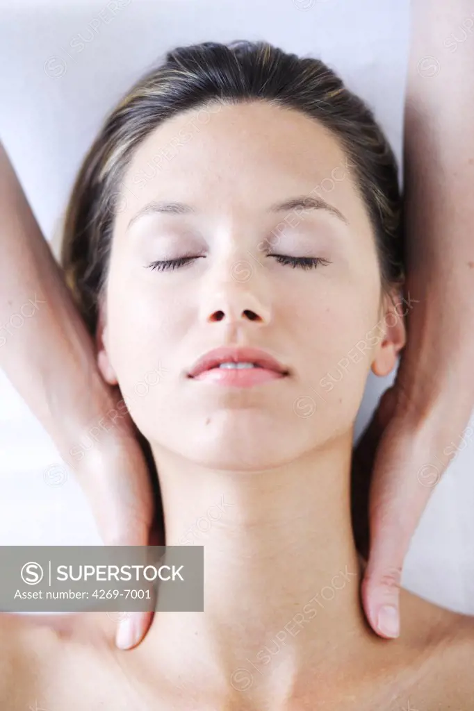 Woman receiving a neck massage.