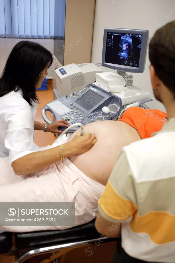 Pregnant woman undergoing foetal ultrasound scan. Prenatal diagnosis center, department of Obstetrics and Gynecologics, Limoges hospital, France.