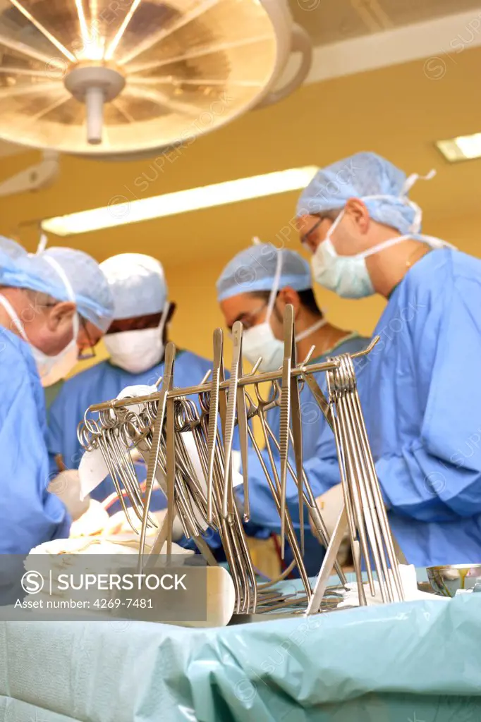 Medical team performing surgery. Department of gastroenterological surgery, Limoges hospital, France.