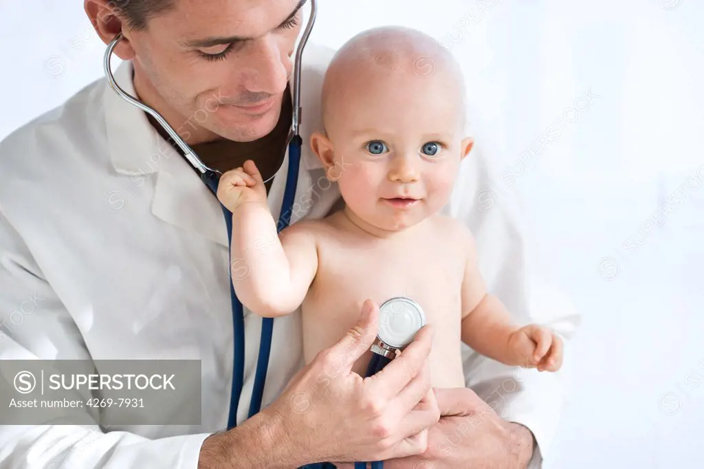 Pediatrician examining 9 months old baby with a stethoscope.