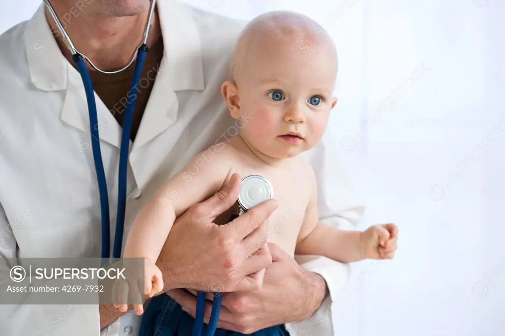 Pediatrician examining 9 months old baby with a stethoscope.