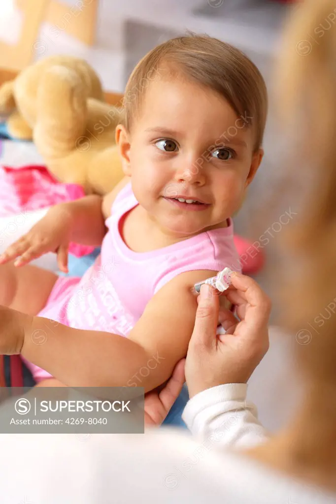 19 months old baby receiving vaccination.